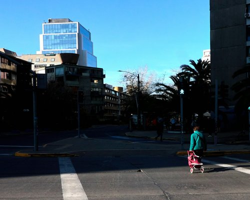 Person walking comfortably on a clear day in Santiago