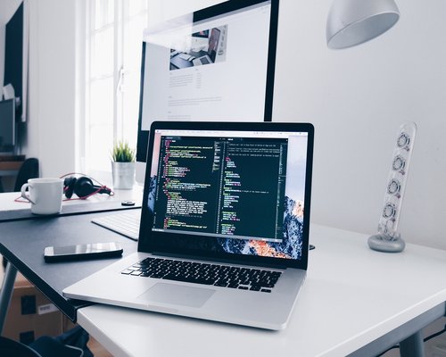 Ergonomic home office setup with laptop at eye level