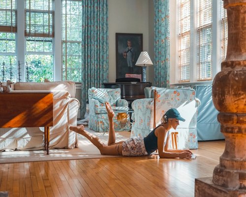 Person relaxing comfortably with a book in a living room